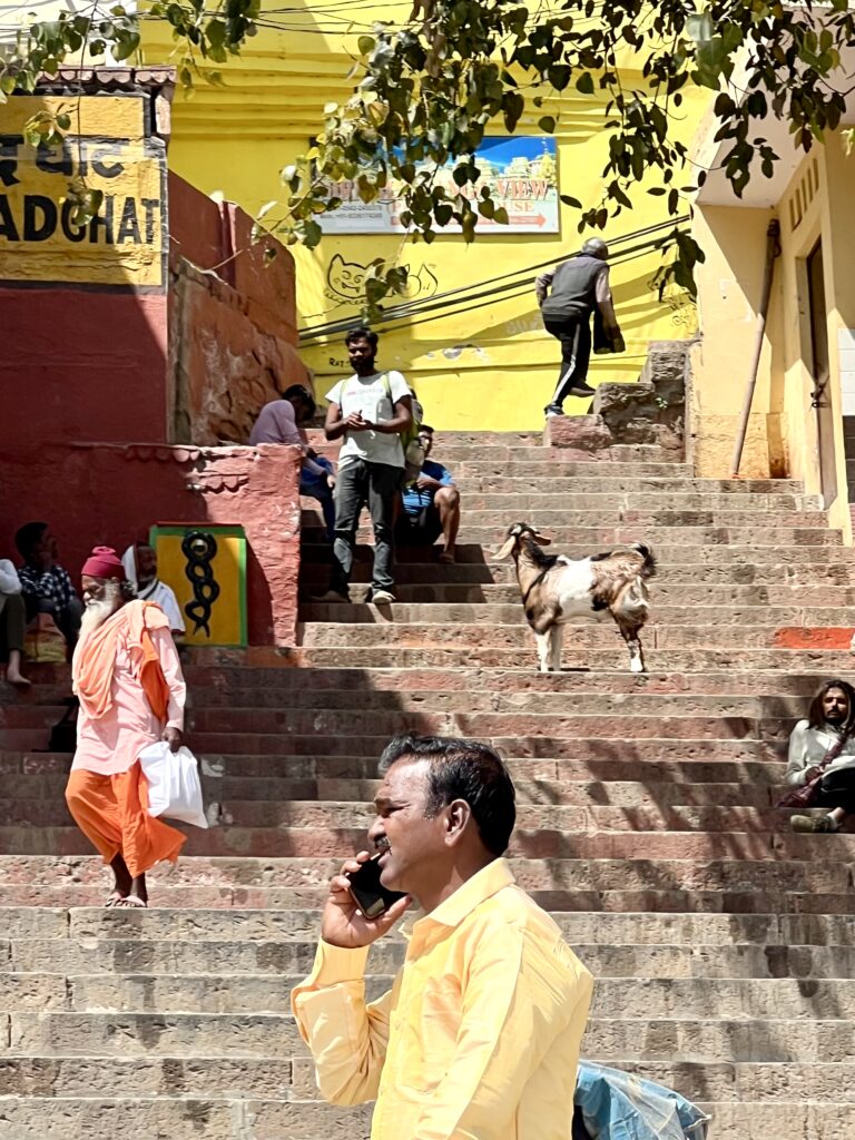 Everyday life on the ghats of Varanasi, India — different people sharing the same sacred steps along the Ganges